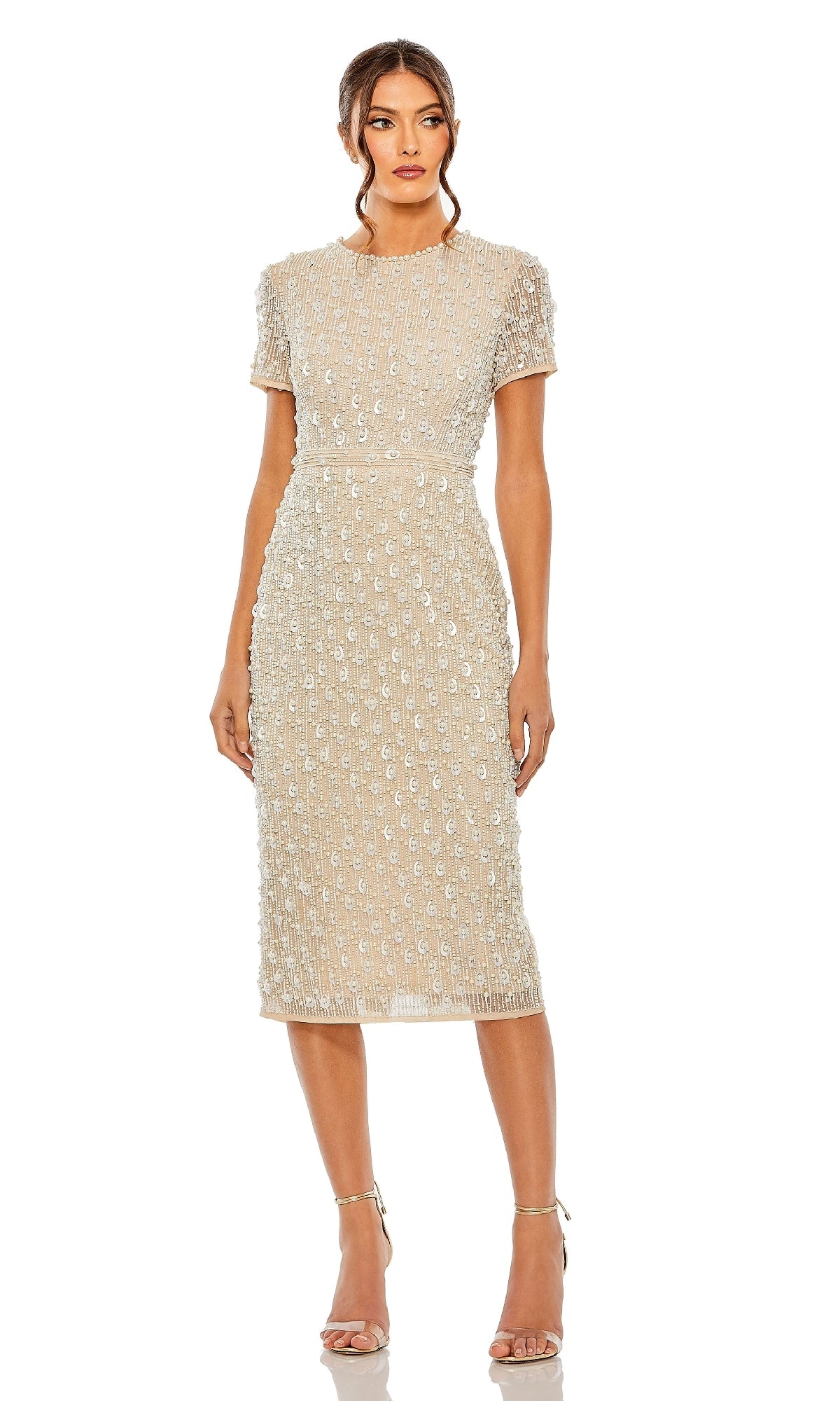 A woman wearing the Mac Duggal 93893 Midi Wedding-Guest Dress with a sequin embellished design and strappy heels stands against a plain white background.
